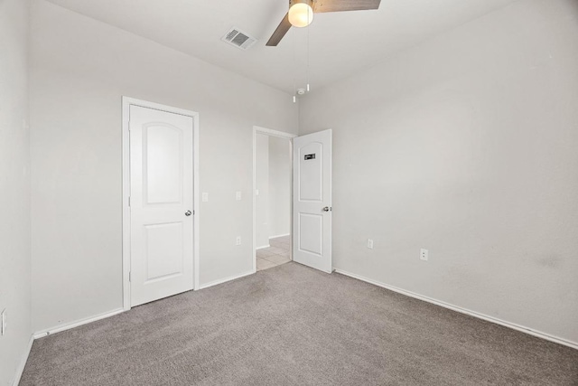 7001 Midlothian Dr, Austin, TX 78754 - unfurnished bedroom with carpet flooring, ceiling fan, and baseboards