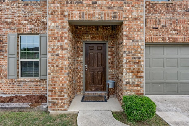 7001 Midlothian Dr, Austin, TX 78754 - doorway to property featuring brick siding and a garage