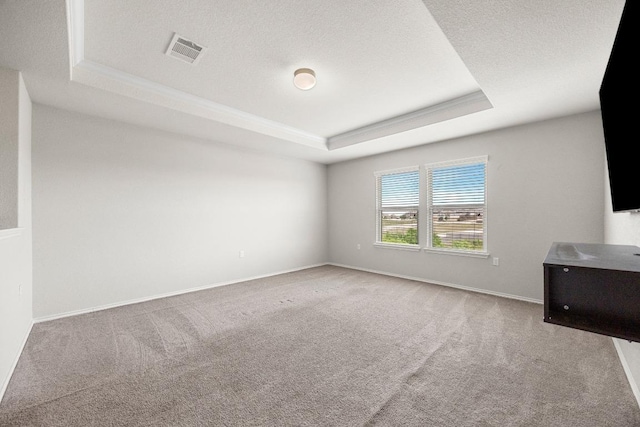 7001 Midlothian Dr, Austin, TX 78754 - carpeted spare room featuring a raised ceiling and baseboards