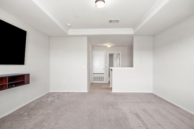 7001 Midlothian Dr, Austin, TX 78754 - unfurnished living room featuring a tray ceiling, crown molding, carpet floors, and baseboards