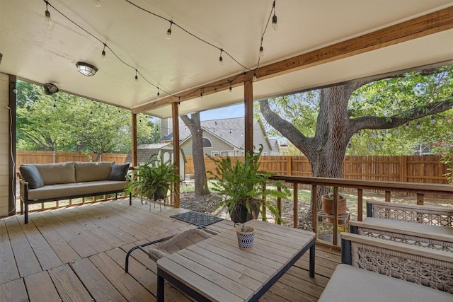 2003 Ploverville Ln, Austin, TX 78728 - wooden terrace featuring an outdoor living space, a fenced backyard, an outbuilding, and a shed