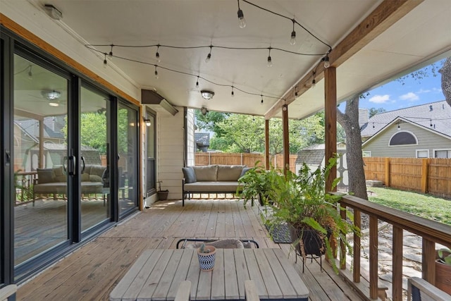 2003 Ploverville Ln, Austin, TX 78728 - wooden deck featuring a fenced backyard, an outdoor living space, an outbuilding, and a storage shed