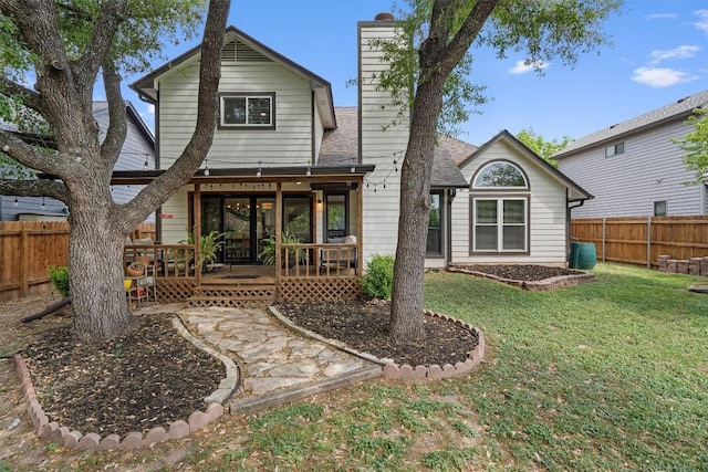 2003 Ploverville Ln, Austin, TX 78728 - back of property with a chimney, a fenced backyard, and a shingled roof