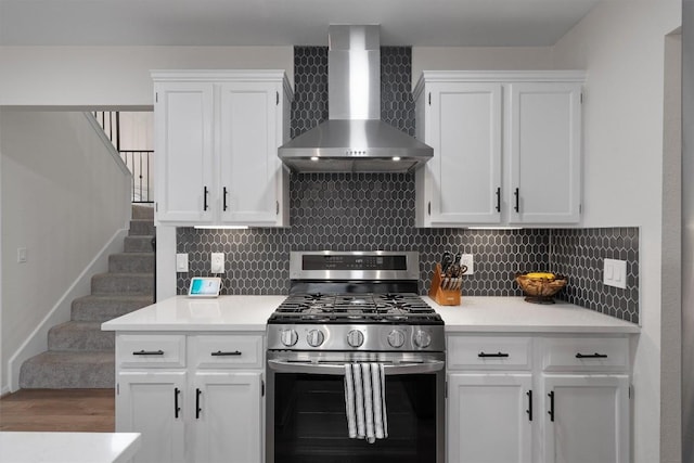 2003 Ploverville Ln, Austin, TX 78728 - kitchen featuring stainless steel gas range, white cabinetry, and wall chimney range hood