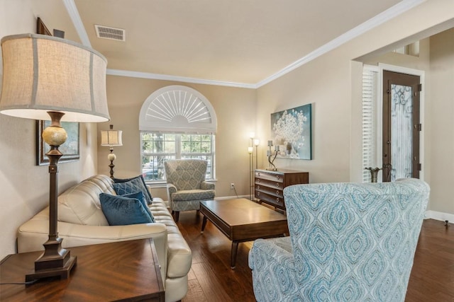 2505 Livenza Pl, Leander, TX 78641 - living area with dark wood-style flooring and ornamental molding