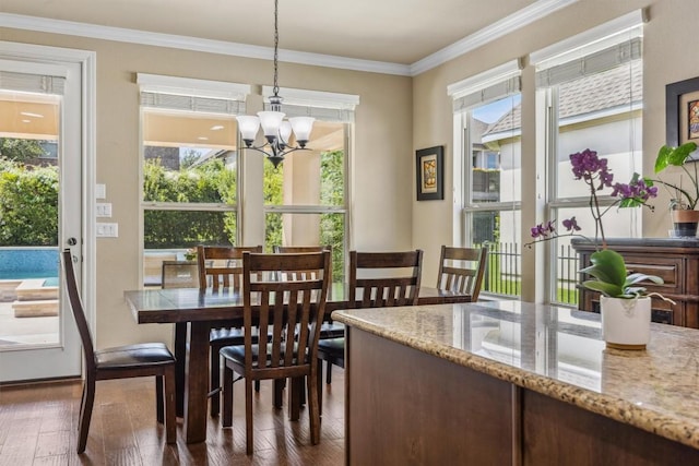 2505 Livenza Pl, Leander, TX 78641 - dining room with plenty of natural light, dark wood-style flooring, a chandelier, and crown molding
