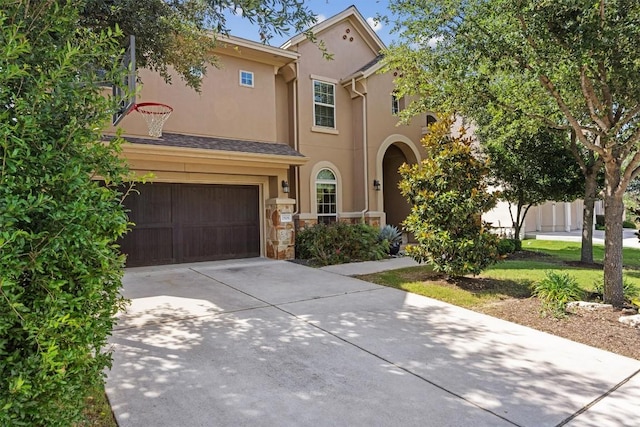 2505 Livenza Pl, Leander, TX 78641 - mediterranean / spanish-style home with driveway, a garage, stucco siding, and stone siding