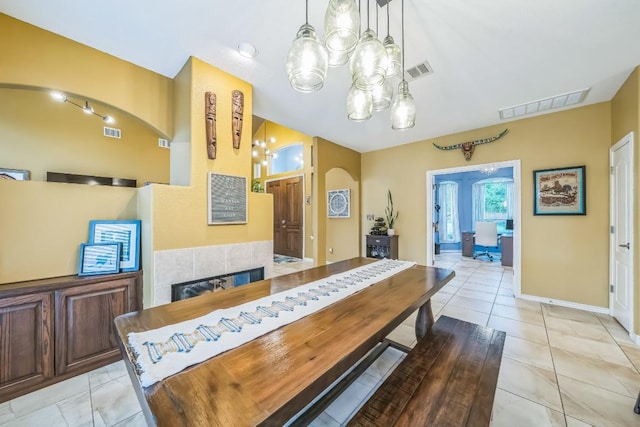 dining space featuring baseboards, a notable chandelier, and visible vents