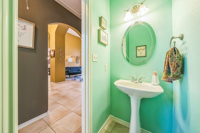 bathroom with tile patterned floors and baseboards