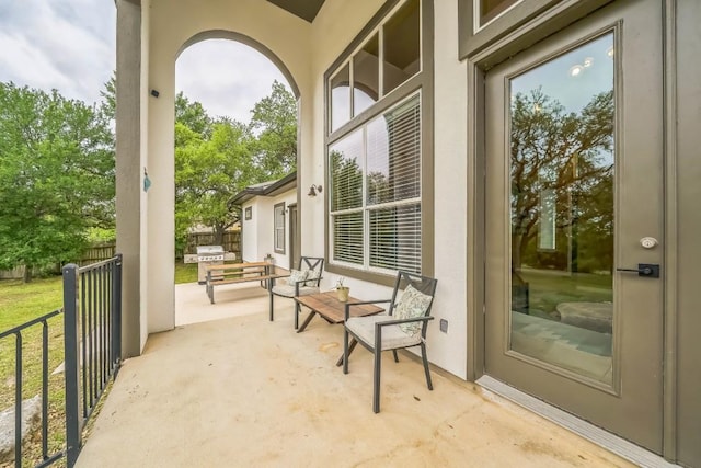 view of patio / terrace featuring fence