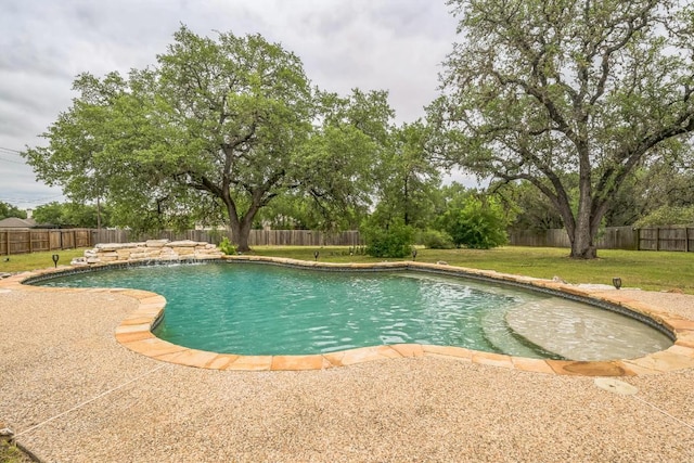 view of pool featuring a patio area, a fenced in pool, a lawn, and a fenced backyard