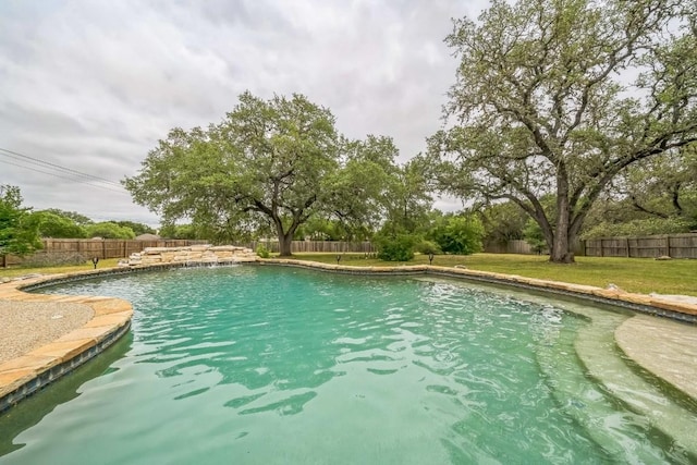 view of pool with a fenced in pool, a lawn, and a fenced backyard