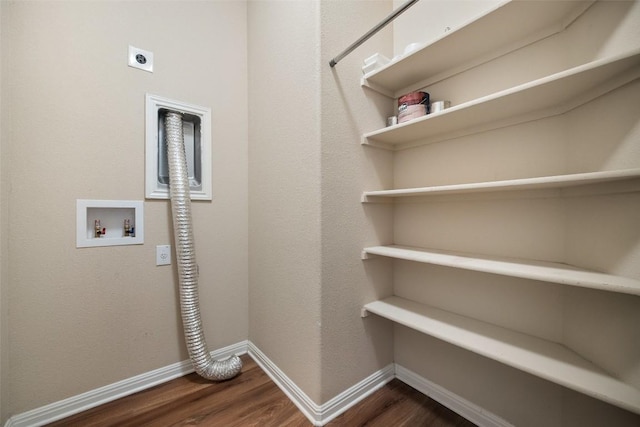 clothes washing area with hookup for a washing machine, electric dryer hookup, baseboards, dark wood-style flooring, and laundry area