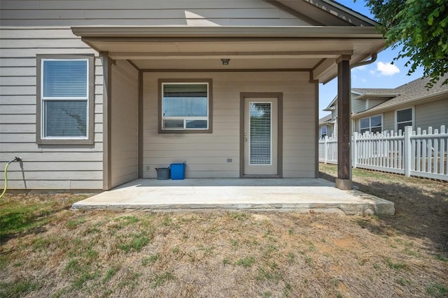back of house with a lawn, a patio, and fence