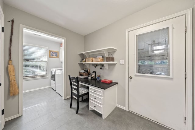 office with washer and dryer and baseboards