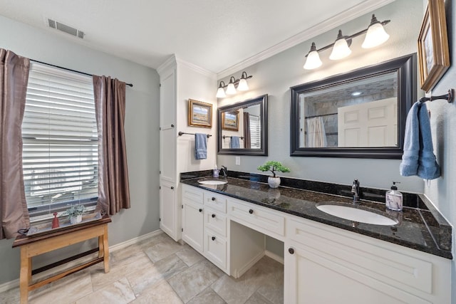 25 Doolittle Dr, Wimberley, TX 78676 - full bath featuring double vanity, ornamental molding, and baseboards