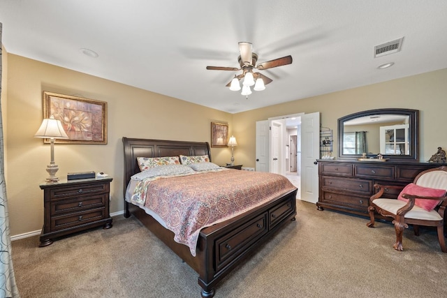bedroom with baseboards, a ceiling fan, visible vents, and carpet