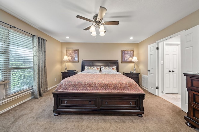 25 Doolittle Dr, Wimberley, TX 78676 - bedroom with multiple windows, light carpet, a ceiling fan, baseboards, and recessed lighting