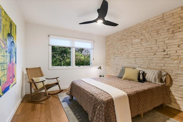 1213 Falcon Ledge Dr, Austin, TX 78746 - bedroom with wood finished floors and a ceiling fan