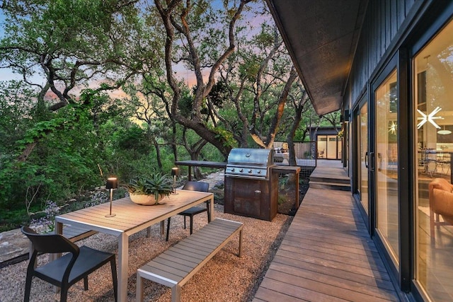 1213 Falcon Ledge Dr, Austin, TX 78746 - wooden deck featuring grilling area and outdoor dining space