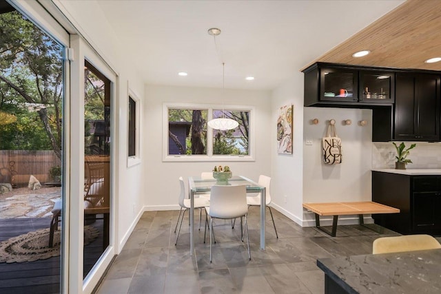 1213 Falcon Ledge Dr, Austin, TX 78746 - dining area with baseboards and recessed lighting