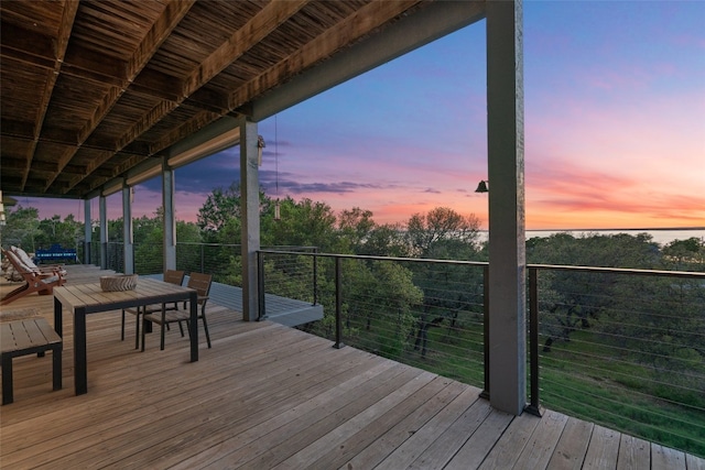 wooden terrace featuring outdoor dining space