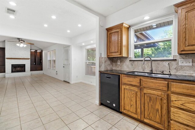 2210 Lasso Dr, Round Rock, TX 78681 - kitchen featuring tasteful backsplash, a sink, light tile patterned flooring, black dishwasher, and visible vents