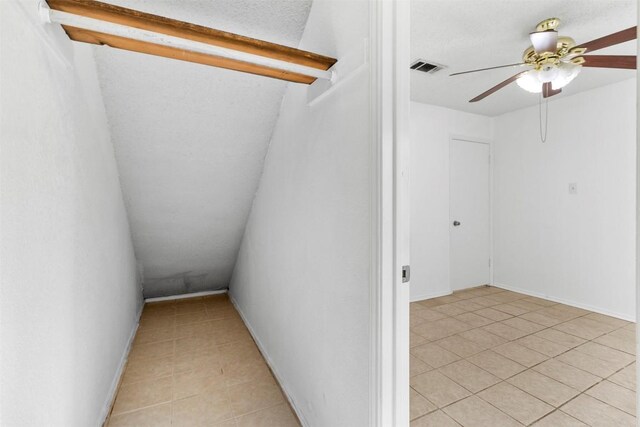 2210 Lasso Dr, Round Rock, TX 78681 - interior space featuring lofted ceiling, a ceiling fan, visible vents, and light tile patterned floors