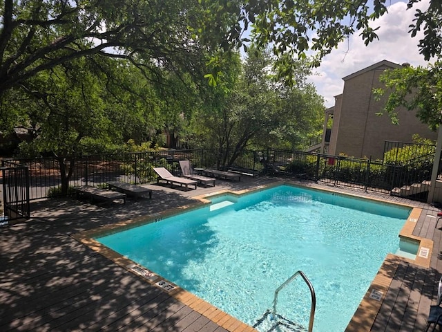 6600 Valleyside Rd Unit 24, Austin, TX 78731 - community pool featuring a wooden deck
