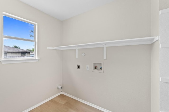 washroom featuring laundry area, wood finished floors, hookup for a washing machine, baseboards, and electric dryer hookup