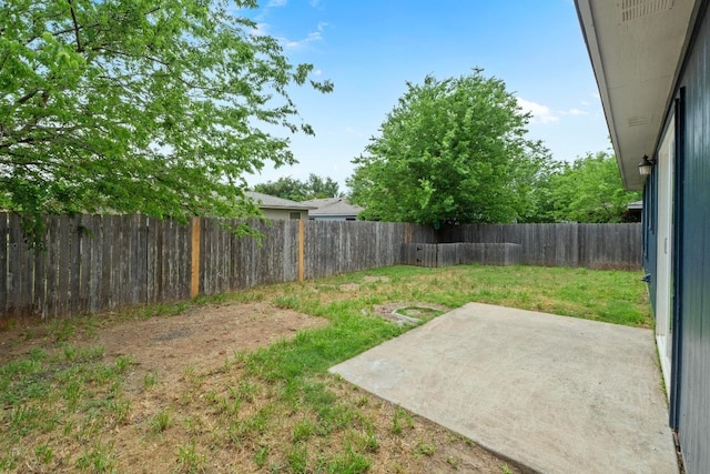 view of yard with a fenced backyard and a patio