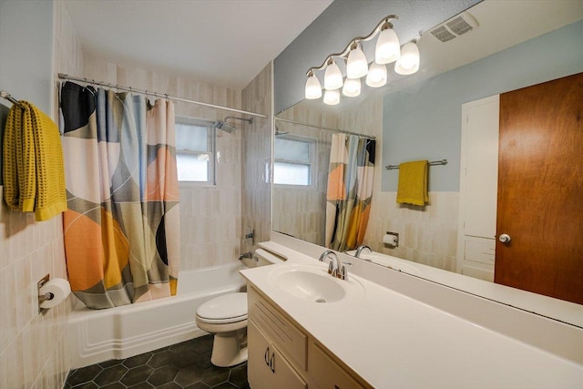 bathroom featuring vanity, shower / bathtub combination with curtain, toilet, tile patterned flooring, and visible vents