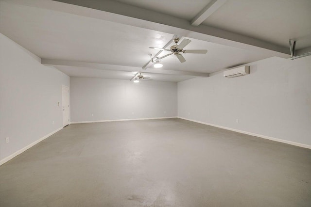 spare room featuring concrete floors, a wall mounted AC, baseboards, and ceiling fan