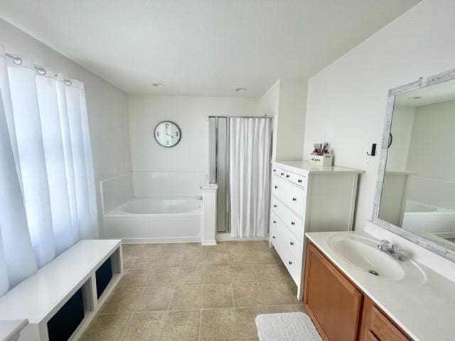 bathroom with a bath and vanity