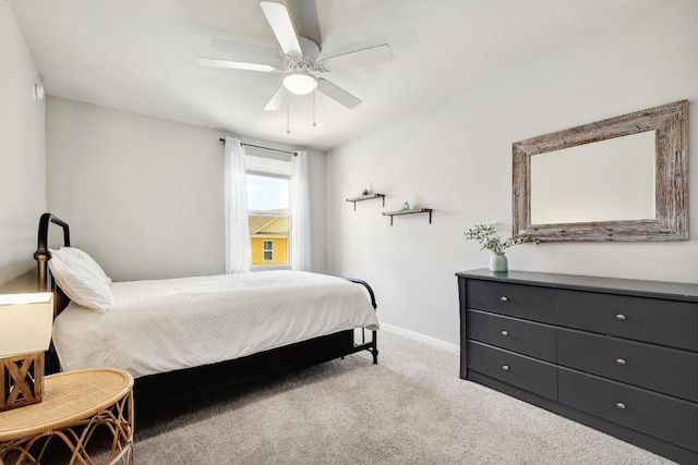 184 Martha Ln, Kyle, TX 78640 - carpeted bedroom with baseboards and ceiling fan