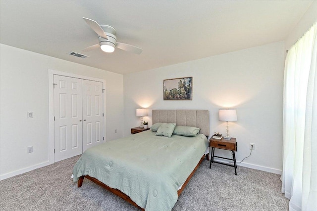 6300 Merriwood Dr, Austin, TX 78745 - bedroom featuring light carpet, a closet, and a ceiling fan