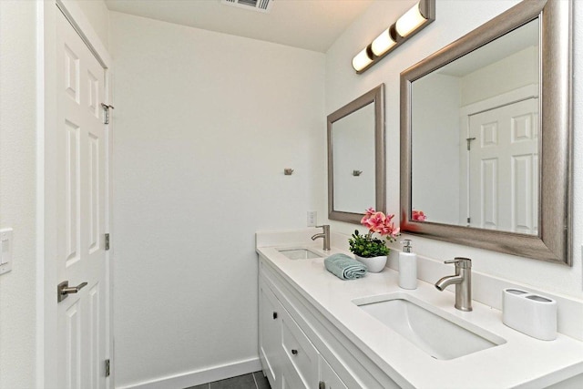 6300 Merriwood Dr, Austin, TX 78745 - bathroom with double vanity and tile patterned floors