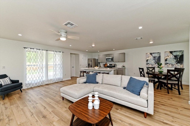 6300 Merriwood Dr, Austin, TX 78745 - living area featuring light wood finished floors, ceiling fan, and recessed lighting
