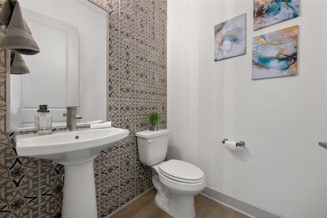 298 Smoke Tree Cir, Dripping Springs, TX 78620 - half bath featuring wood finished floors and toilet