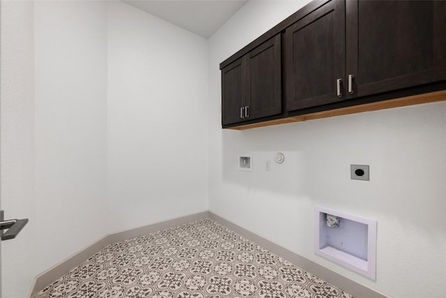 298 Smoke Tree Cir, Dripping Springs, TX 78620 - laundry area featuring hookup for an electric dryer, cabinet space, washer hookup, hookup for a gas dryer, and tile patterned floors