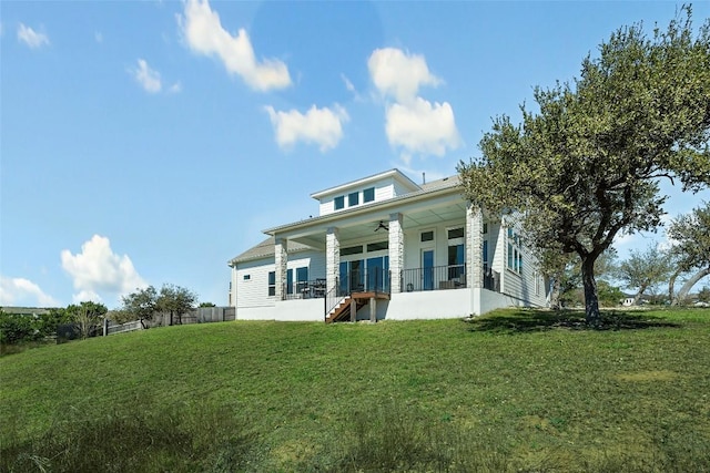 298 Smoke Tree Cir, Dripping Springs, TX 78620 - rear view of property featuring ceiling fan, stairway, a yard, and covered porch