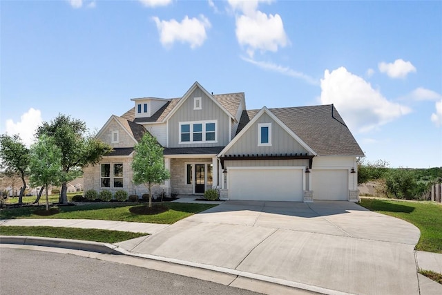 298 Smoke Tree Cir, Dripping Springs, TX 78620 - craftsman inspired home with board and batten siding, driveway, a front yard, and an attached garage