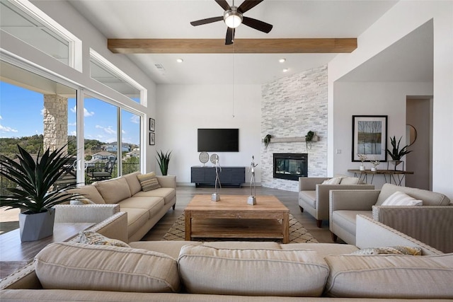 298 Smoke Tree Cir, Dripping Springs, TX 78620 - living area with wood finished floors, a ceiling fan, beam ceiling, a fireplace, and recessed lighting