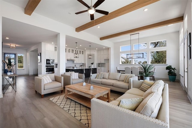298 Smoke Tree Cir, Dripping Springs, TX 78620 - living room featuring beamed ceiling, ceiling fan, recessed lighting, and light wood-style flooring