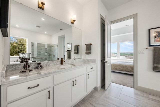 298 Smoke Tree Cir, Dripping Springs, TX 78620 - ensuite bathroom with vanity, a shower stall, and recessed lighting