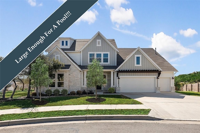 298 Smoke Tree Cir, Dripping Springs, TX 78620 - view of front of property featuring stone siding, concrete driveway, board and batten siding, an attached garage, and a front yard