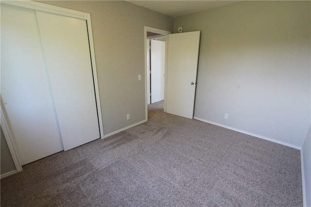 122 Bayliss St, Hutto, TX 78634 - unfurnished bedroom featuring baseboards, carpet floors, and a closet