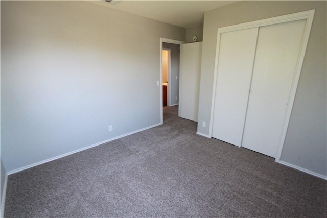 122 Bayliss St, Hutto, TX 78634 - unfurnished bedroom with baseboards, carpet floors, and a closet