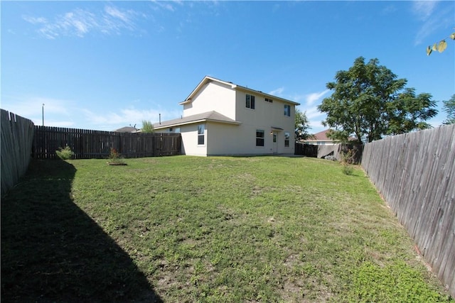 122 Bayliss St, Hutto, TX 78634 - view of yard featuring a fenced backyard