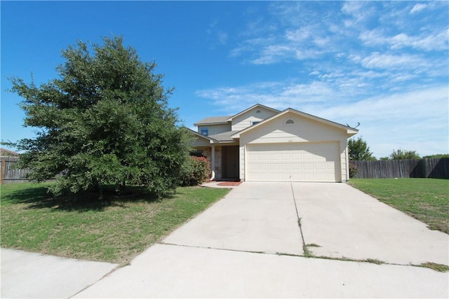 122 Bayliss St, Hutto, TX 78634 - view of front facade featuring fence, driveway, a front lawn, and a garage